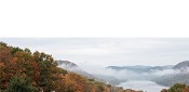 A winding road through autumn hills